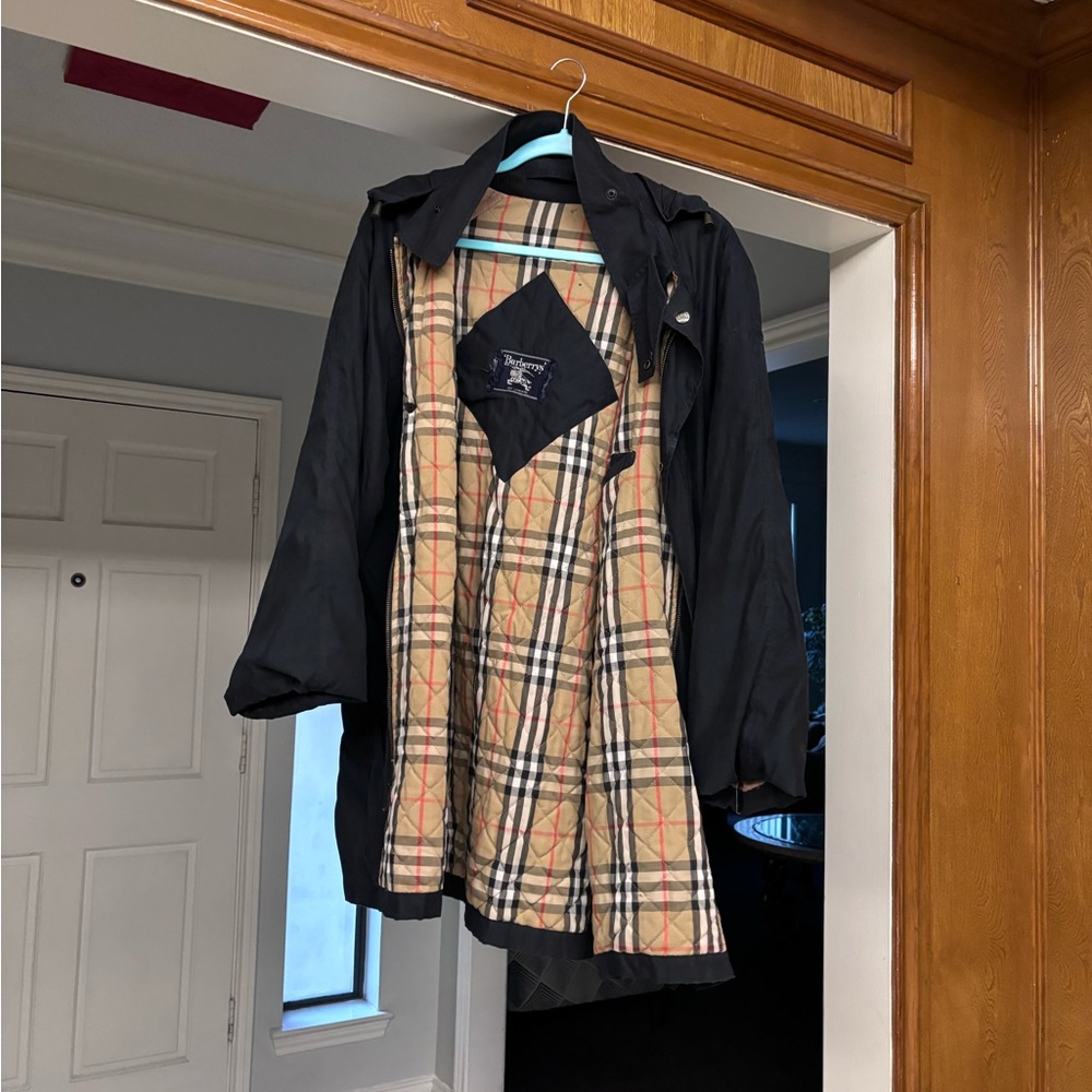 Authentic used Burberry coat has a small rip on left arm as show in picture